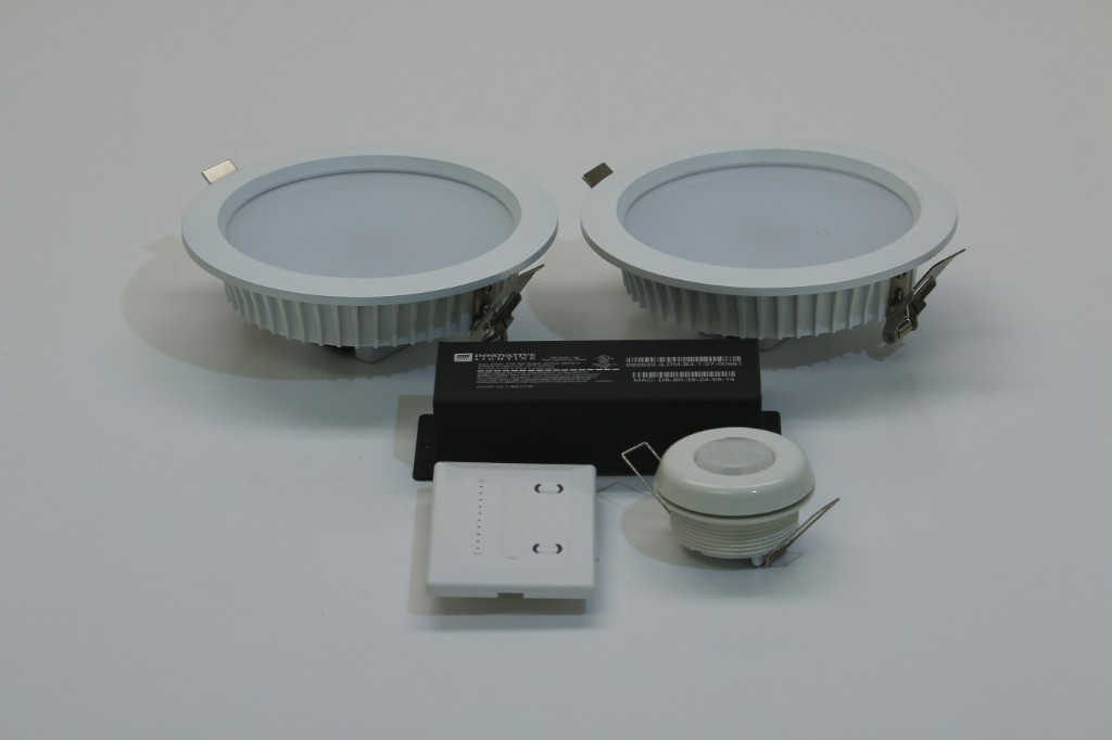 GENISYS PoE lighting starter kit components: two LED downlights, Innovative Lighting IntelliDrive, wall dimmer, and occupancy sensor