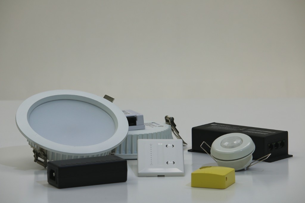 GENISYS PoE lighting starter kit hardware layout with downlight, wall switch, occupancy sensor, and IntelliDrive