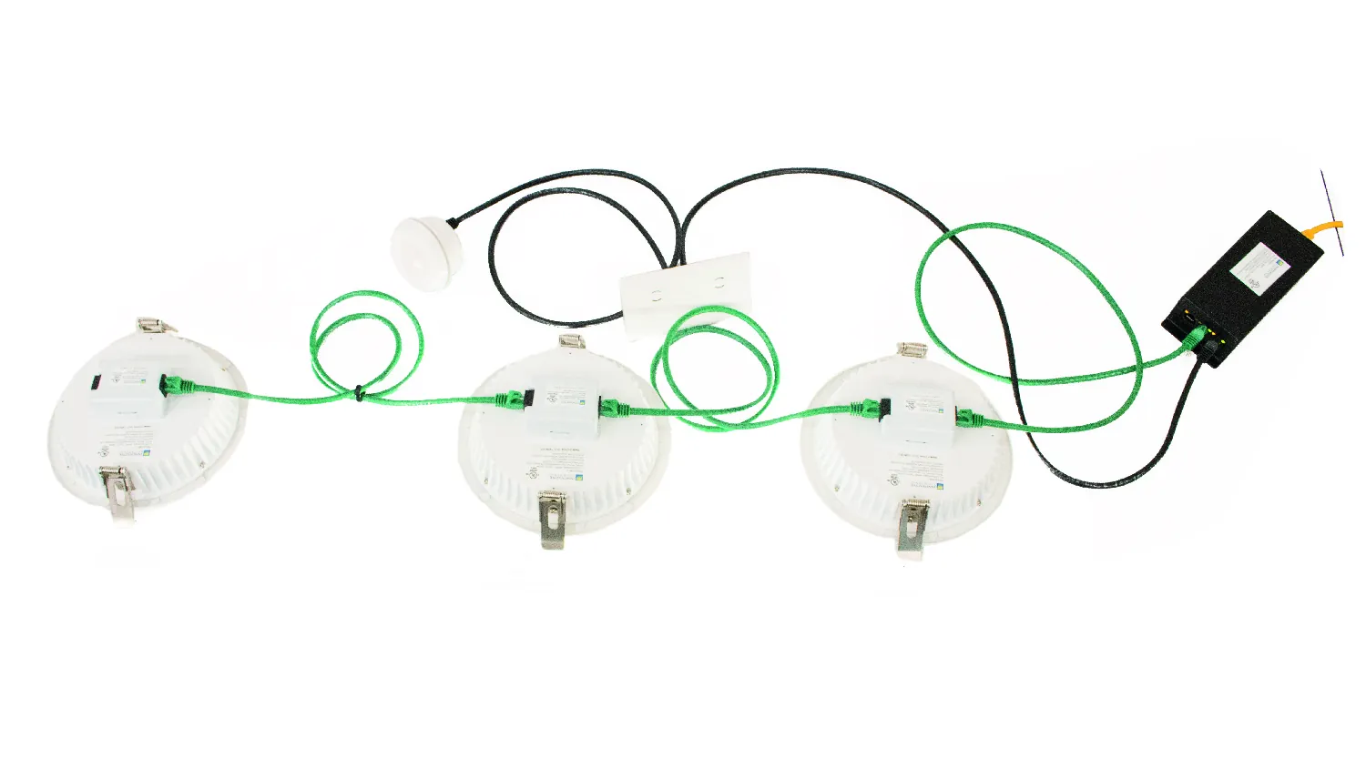 GENISYS PoE lighting demonstration with fixtures, sensor, wall switch, cabling, and controller