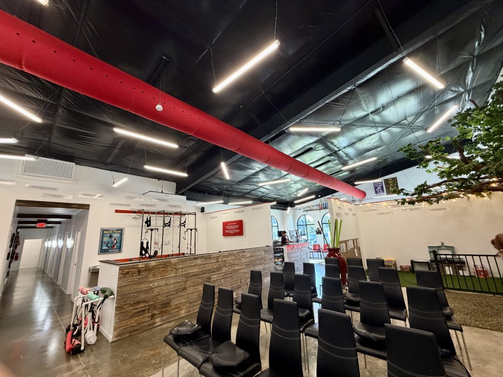 Liberation Chiropractic lobby with suspended SmoothLite GENISYS PoE lighting