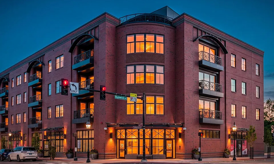 Portsmouth mixed-use condos at dusk with GENISYS PoE lighting in every residence