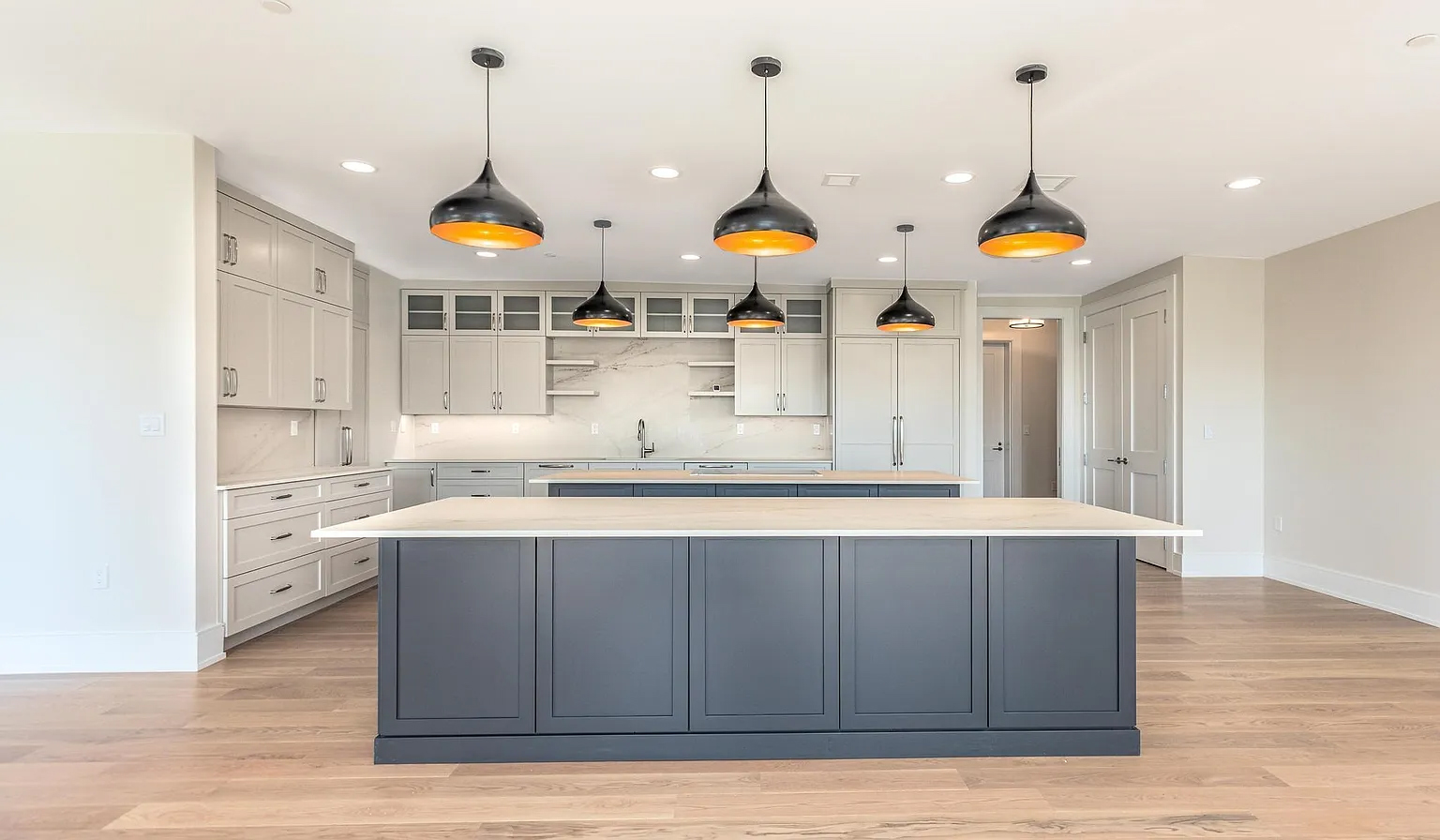 Portsmouth condo kitchen with GENISYS PoE downlights and pendant lighting over the island