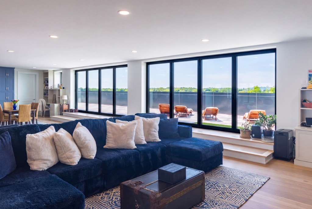 Portsmouth penthouse living room with GENISYS PoE downlights and terrace views