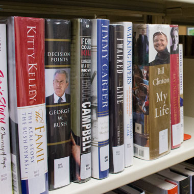 Book stacks at Roland Public Library under GENISYS PoE lighting