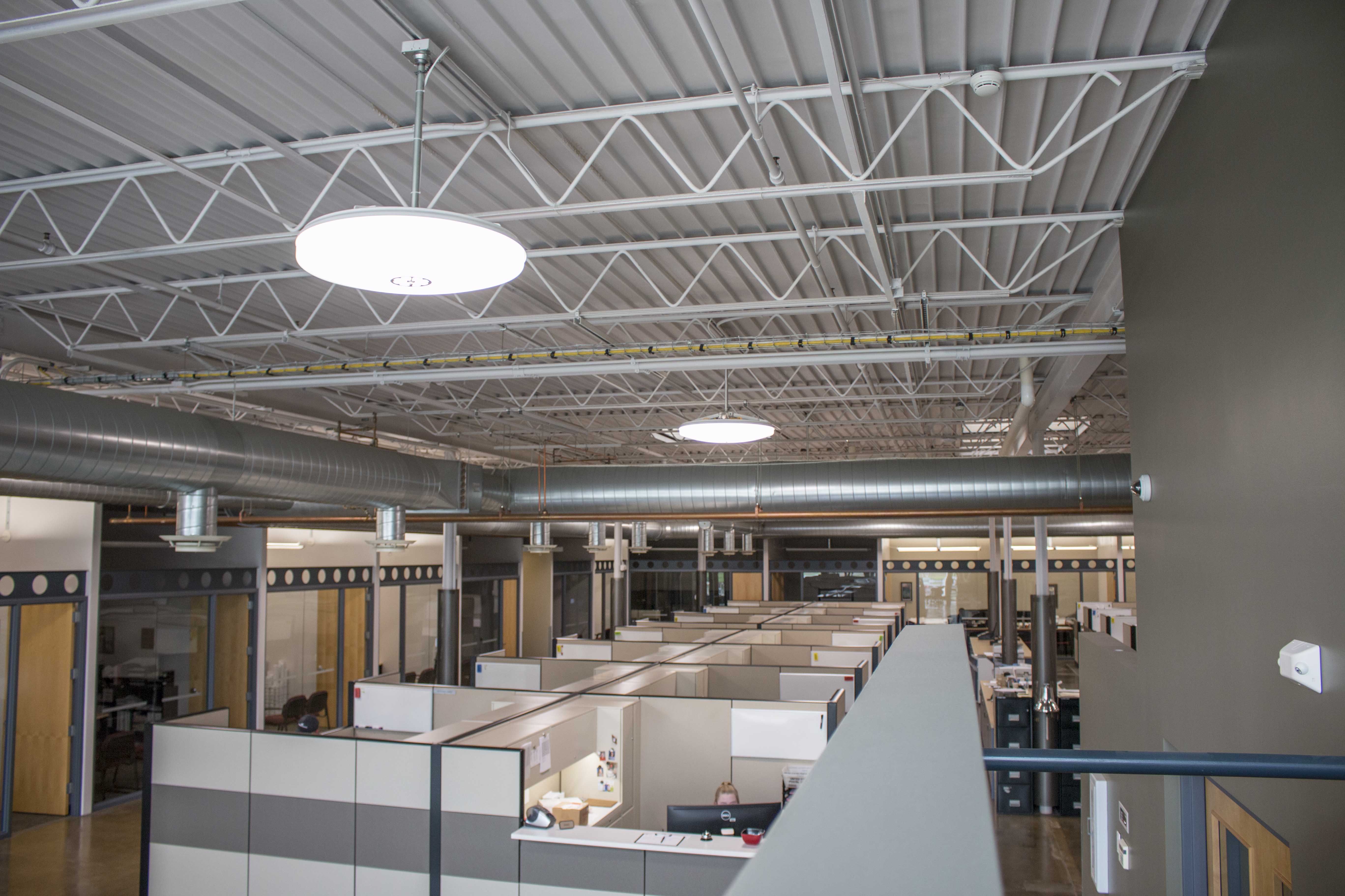 Waldinger workspace desks under GENISYS PoE pendant fixtures